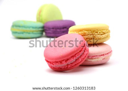 Cake macaron or macaroon isolated on white background from above, colorful almond cookies, pastel colors, vintage card, front view