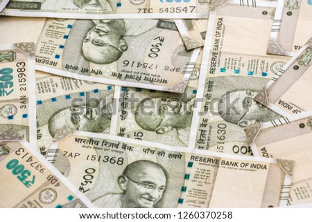 Close up view of brand new indian 500 rupees banknotes. Colorful money background.