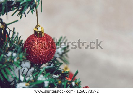 Christmas decoration. Hanging red balls on pine branches Christmas tree garland and ornaments. with copy space