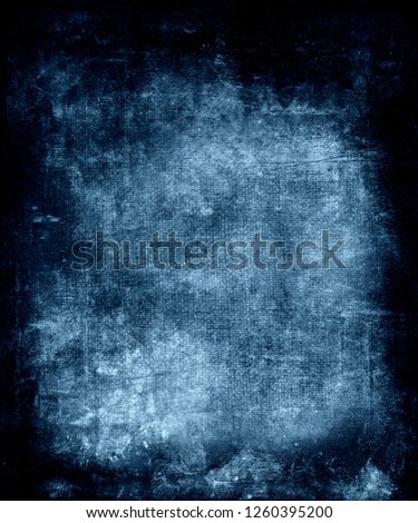 Blue grunge fabric scratched background with black frame and space for your text or picture, trendy texture