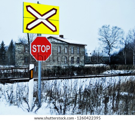 
"Stop" sign in front of the railway