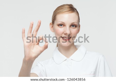 Beautiful caucasian nurse on white background