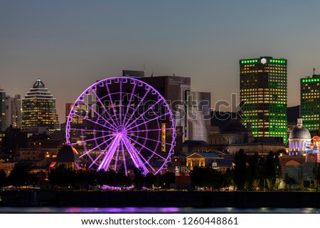Great Wheel of Montreal at night, view from Sante Helen's Island across St Lawrence River, Quebec, Canada