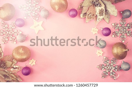 Colorful Christmas overhead in modern pink, gold and silver theme gift and ornaments with applied retro vintage style filters.