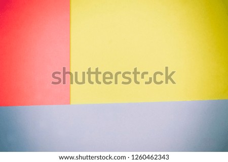 Abstract geometric background of colored paper sheets