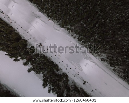 Beautiful aerial drone landscape photo of mountains in cold snowy day.Travel destination for active tourism in winter.Beauty of nature in Carpathian mountain park.