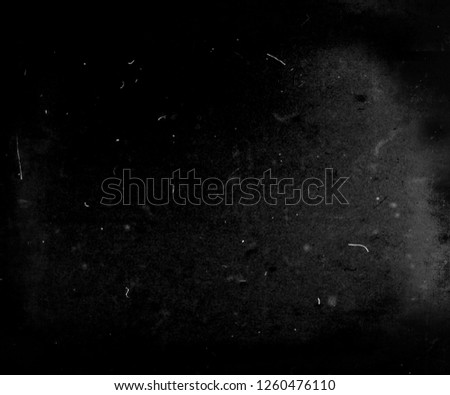Black grunge scratched scary background, old film effect, dusty texture