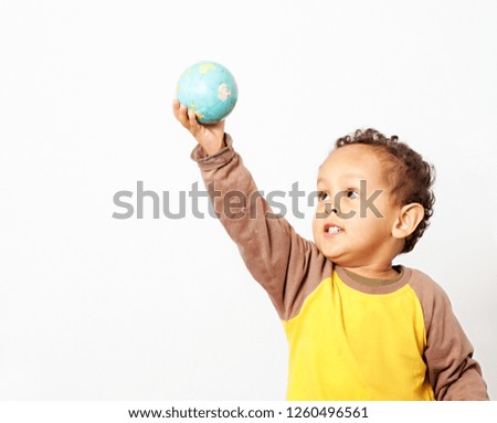 boy holding a globe on earth day with white background stock image and stock photo