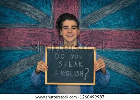 blackboard with english speaking message and british flag