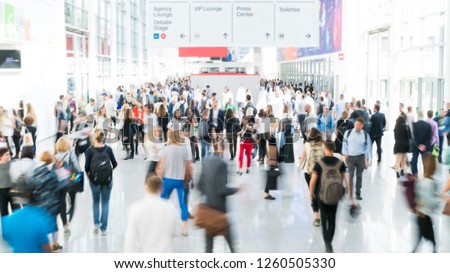 blurred business people at a trade fair Royalty-Free Stock Photo #1260505330