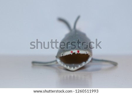 toy shark on white background with sharp teeth