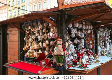 Beautiful multi-colored Christmas balls and toys for decorating house at Christmas Market. Xmas market in Europe on holidays