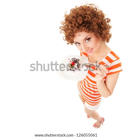 fun woman eating the cake on the white background