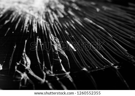 Broken glass - white lines on black background, design element. touch screen smartphone with broken screen