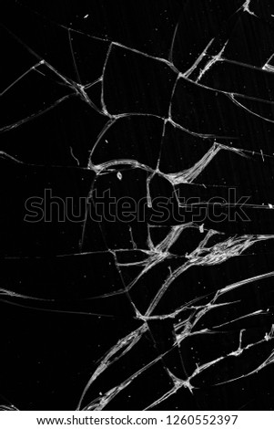 Broken glass - white lines on black background, design element. touch screen smartphone with broken screen