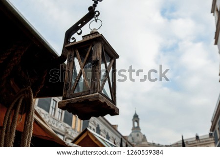 Old vintage wooden lamp on street of old germany city