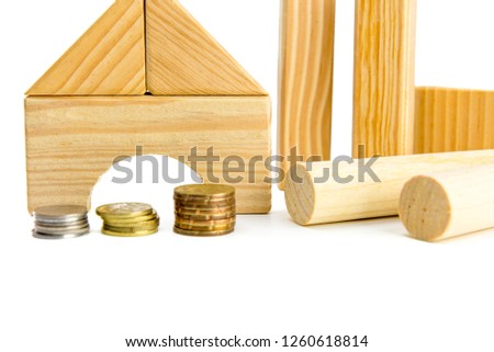 house mortgage or house loan concept. stack of coins and house model. money saving plan for buying house.