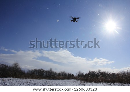 drone flying winter blue sky