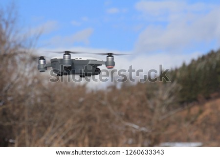 drone flying winter blue sky