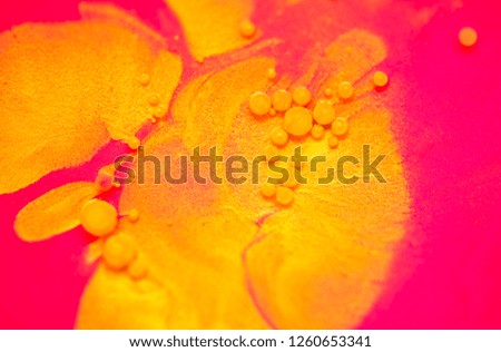 Colorful paint background in concept Fantasy luxury texture. Colors dropped into liquid and photographed while in motion. colorful circle abstract composition.