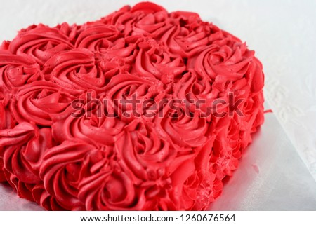Red cream cake rose swirl. love shape cake, romantic theme