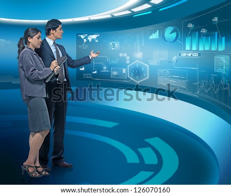young businesspeople working on futuristic virtual screen