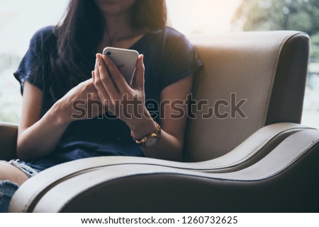 Young men wearing casual shirts.sit enjoy relax on sofa using cell phone.typing texting message chatting with friend.concept for modern communication in the business world financial Transactions 