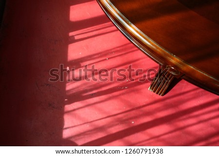 the shadow on red floor