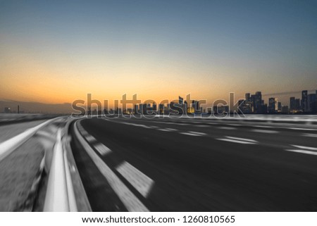 urban traffic road with cityscape in background, China
