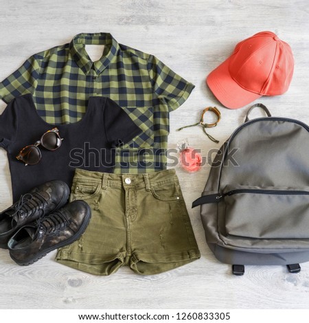 Stylish women's or teenager's clothing set with accessories: shirt, top, backpack, sunglasses, bracelet, perfume, boots, cap in living coral. Pantone color of the year 2019. Fashion trend concept