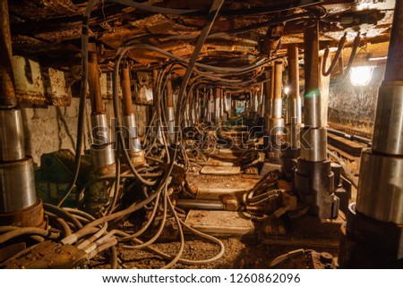 Underground coal mine with automated timbering. Coalface, drift. Royalty-Free Stock Photo #1260862096