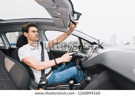 Young business man test drive new car 