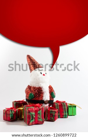 Santa claus doll with gift box isolated white background. With top red white text box.