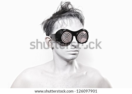 young man with white skin in strange red glasses close up