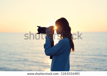 A woman takes pictures of nature                     
