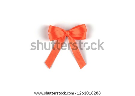 Red silk gift bow isolated on white background. Festive concept.