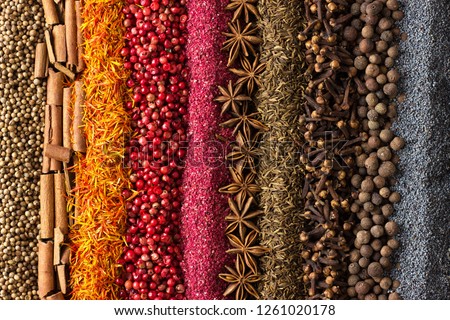 collection of condiments scattered on the table. Spice background for label decoration