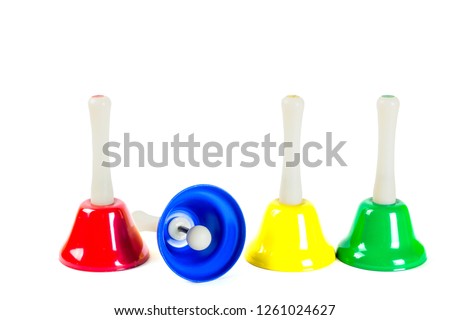 Coloured musical handbells set, isolated on white background Royalty-Free Stock Photo #1261024627