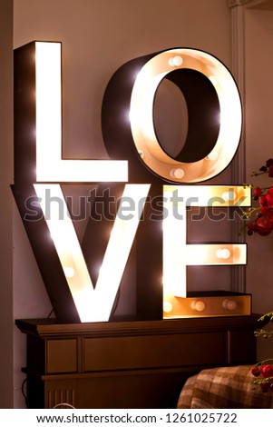 Glowing letters of the word "love".  Large glowing letters "Love." Interior decor