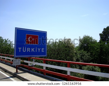                          Turkish border sign and Turkish flag between Turkey (Turkiye) and Greece.       