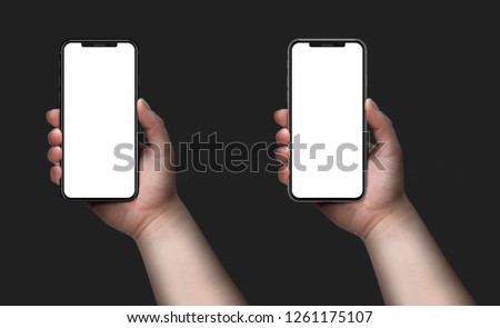 Woman holding smartphone with blank screen. 
