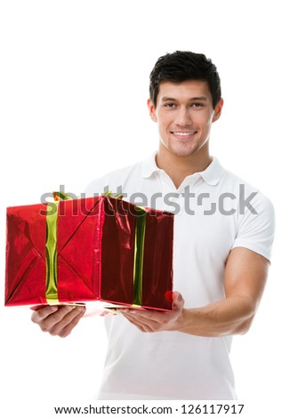 Offering a present wrapped in red paper sporty man, isolated on white