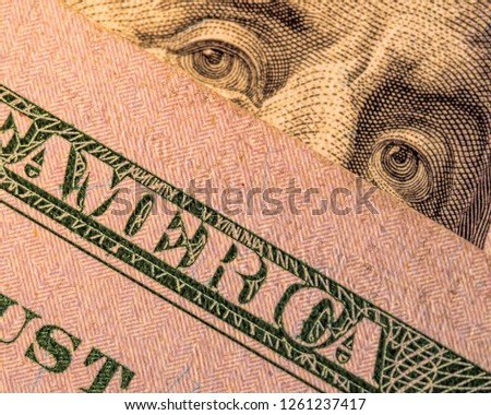 The word "America" on the dollar banknote close up. symbol of capitalism and democracy. big brother is watching you.