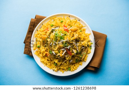 Masala Rice or masale bhat - is a spicy vegetable fried rice / biryani or Pulav usually made during wedding occassions in maharashtra, India Royalty-Free Stock Photo #1261238698