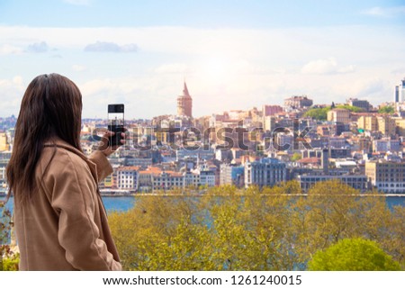 Tourists taking picture panoramic view of Istanbul in Turkey.