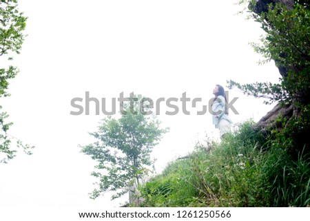 Asian female model poses for pictures in the nature
