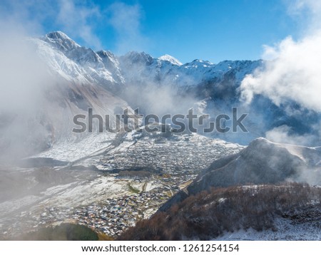 Kazbegi village in the snowy mountains of Georgia. Panorama. Top view