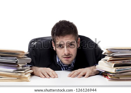 Portrait of a stressed businessman at `work