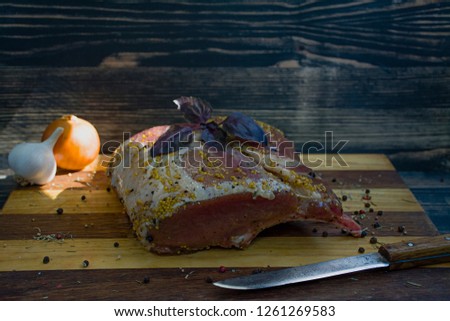 Raw pork meat over wooden background