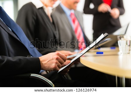 Business - businesspeople have a meeting or workshop with presentation in office, they negotiate or sign a contract